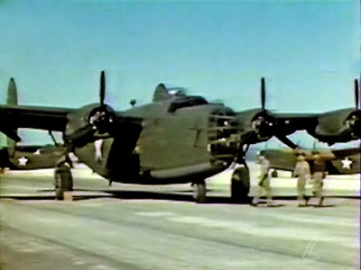 Color photo of Consolidated B-24 Liberator at Muroc AFB taken from the video "How to Fly the B-24D." c 2010 www.zenoswarbirdvideos.com