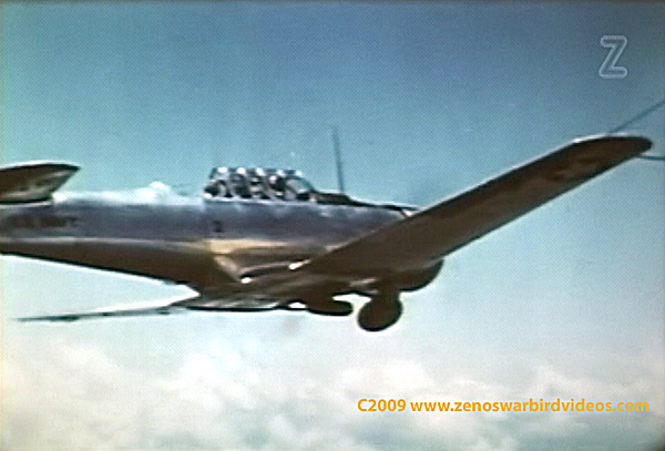 Photo of a North American AT-6 SNJ in flight.